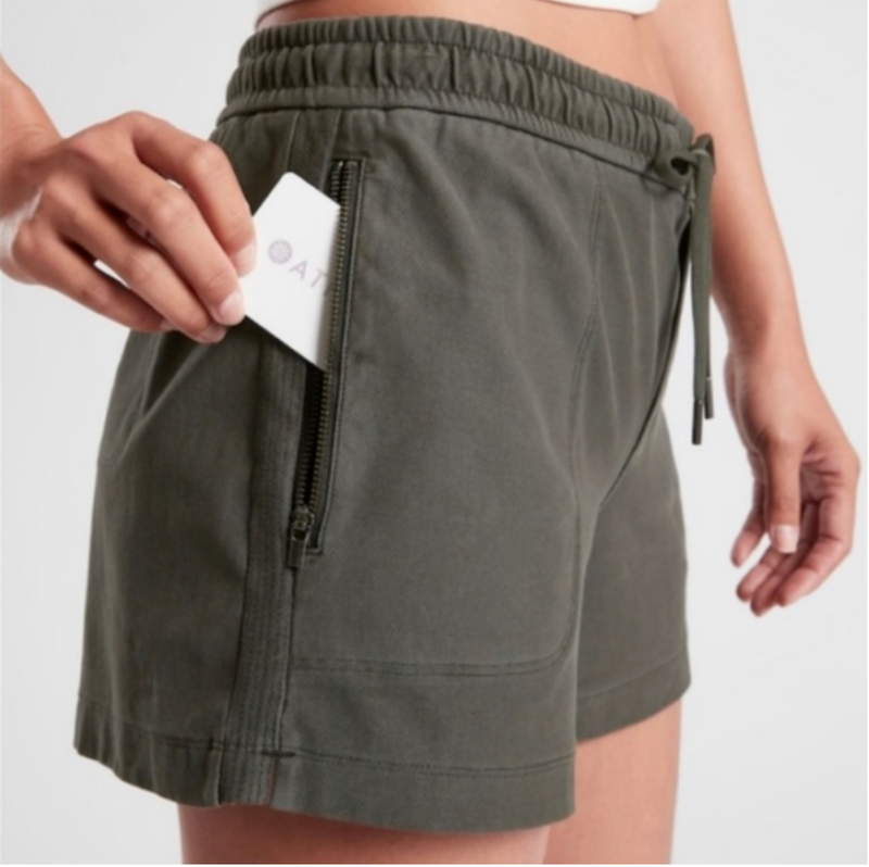 Athleta Cypress Green Elastic Waist Zipper Pockets Farallon Shorts